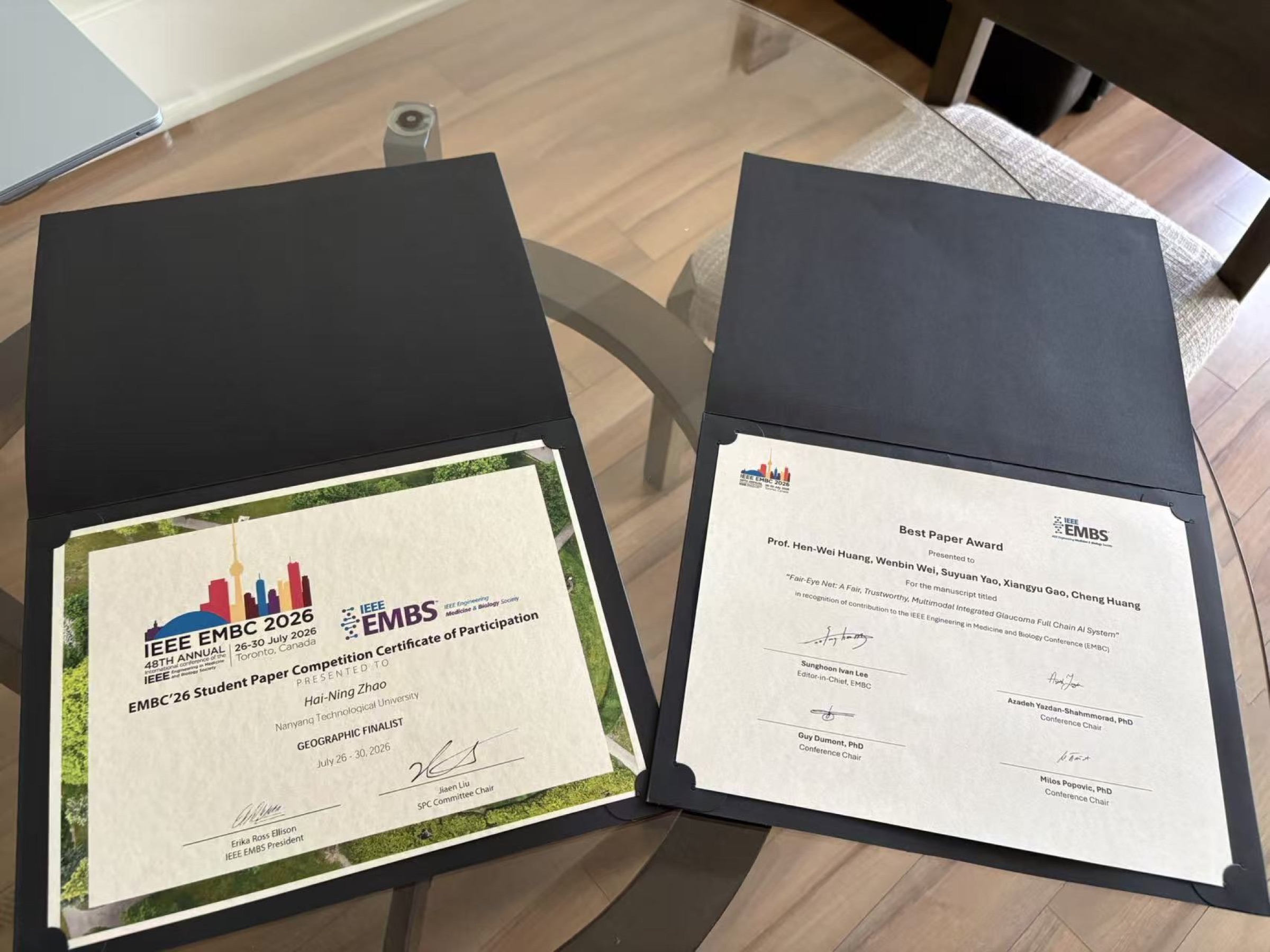 EMBC 2026 award certificates of Zhao Haining and Wei Wenbin